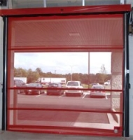 red mesh dock door from inside a warehouse